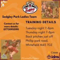 Sedgley Park Ladies stood together under the rugby posts on the pitch